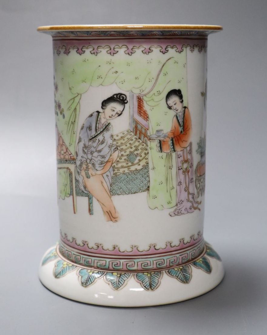 A Chinese cylindrical porcelain brush pot, enamelled with female figures and script, 15cm